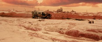 Movie still from “Allegiant” (2016), directed by Robert Schwentke – An old truck parked in the middle of the desert; Extreme Wide shot, High angle