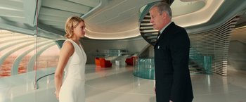 Movie still from “Allegiant” (2016), directed by Robert Schwentke – A man and a woman standing in an empty room; Medium shot, Low angle