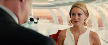 Movie still from “Allegiant” (2016), directed by Robert Schwentke – A beautiful young woman in a white dress; Close Up shot, Over the shoulder angle