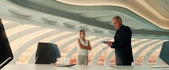 Movie still from “Allegiant” (2016), directed by Robert Schwentke – A man and a woman standing in front of a computer; Medium shot, Low angle