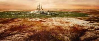 Movie still from “Allegiant” (2016), directed by Robert Schwentke – An oil painting of an island in the middle of the ocean; Extreme Wide shot, High angle