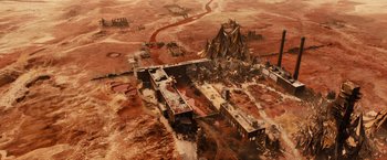 Movie still from “Allegiant” (2016), directed by Robert Schwentke – An aerial view of an abandoned city in the middle of the desert; Extreme Wide shot, Overhead angle