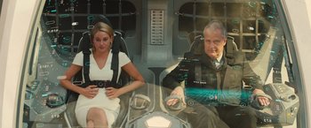Movie still from “Allegiant” (2016), directed by Robert Schwentke – A woman and a man sitting in a plane; Medium shot, Low angle