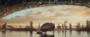 Movie still from “Allegiant” (2016), directed by Robert Schwentke – A boat floating on top of a body of water near a city; Extreme Wide shot, Low angle