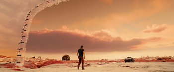 Movie still from “Allegiant” (2016), directed by Robert Schwentke – A man standing in the middle of an empty field; Extreme Wide shot, High angle