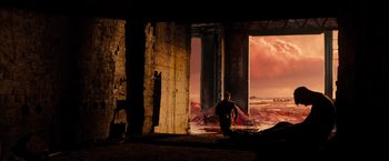Movie still from “Allegiant” (2016), directed by Robert Schwentke – A man standing in front of an open door; Extreme Wide shot, High angle