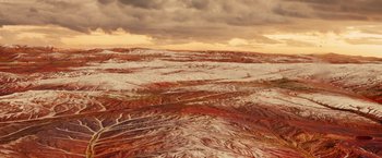 Movie still from “Allegiant” (2016), directed by Robert Schwentke – A view of a desert landscape from a plane window; Extreme Wide shot, High angle