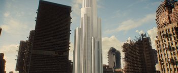 Movie still from “Allegiant” (2016), directed by Robert Schwentke – A tall white building in the middle of a city; Extreme Wide shot, Low angle