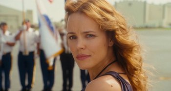 Movie still from “Aloha” (2015), directed by Cameron Crowe – A person with long red hair; Close Up shot, Over the shoulder angle
