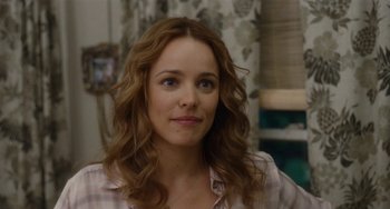 Movie still from “Aloha” (2015), directed by Cameron Crowe – A person with long hair; Close Up shot, Over the shoulder angle