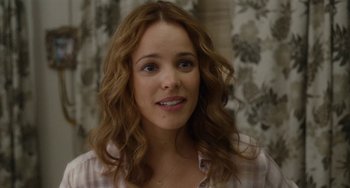 Movie still from “Aloha” (2015), directed by Cameron Crowe – A person with long brown hair; Close Up shot, Over the shoulder angle