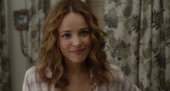 Movie still from “Aloha” (2015), directed by Cameron Crowe – A person with long brown hair; Close Up shot, Over the shoulder angle