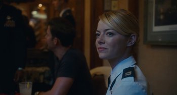 Movie still from “Aloha” (2015), directed by Cameron Crowe – A woman in a military uniform is looking at the camera; Close Up shot, Over the shoulder angle