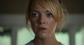 Movie still from “Aloha” (2015), directed by Cameron Crowe – A person wearing a blue shirt; Close Up shot, Over the shoulder angle