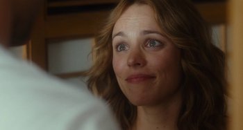 Movie still from “Aloha” (2015), directed by Cameron Crowe – A person looking up at something; Close Up shot, Over the shoulder angle