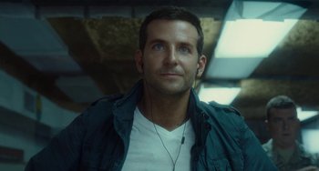 Movie still from “Aloha” (2015), directed by Cameron Crowe – A person wearing headphones; Close Up shot, Over the shoulder angle