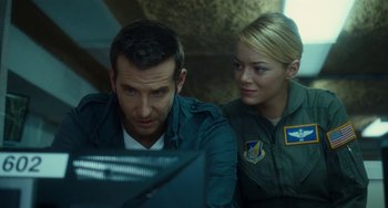 Movie still from “Aloha” (2015), directed by Cameron Crowe – A man and a woman looking at a computer screen; Close Up shot, Over the shoulder angle
