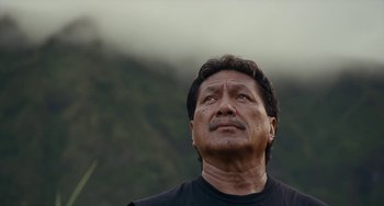 Movie still from “Aloha” (2015), directed by Cameron Crowe – An older man looking up into the sky; Close Up shot, Low angle