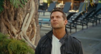 Movie still from “Aloha” (2015), directed by Cameron Crowe – A person wearing a jacket; Close Up shot, Over the shoulder angle