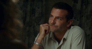 Movie still from “Aloha” (2015), directed by Cameron Crowe – A person sitting in front of a window; Close Up shot, Over the shoulder angle