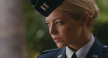 Movie still from “Aloha” (2015), directed by Cameron Crowe – A woman in a military uniform looking to her left; Close Up shot, Over the shoulder angle