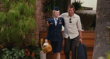Movie still from “Aloha” (2015), directed by Cameron Crowe – A man and a woman are walking together; Wide shot, Over the shoulder angle