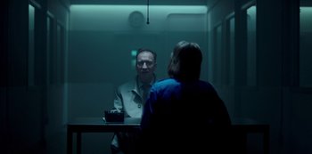 Movie still from “Fargo” (2014), created by Noah Hawley – A man and a woman sitting at a table in front of a mirror; Medium shot, Over the shoulder angle