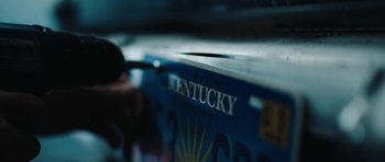 Movie still from “American Animals” (2018), directed by Bart Layton – View of the kentucky state flag; Extreme Close Up shot, High angle