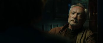 Movie still from “American Animals” (2018), directed by Bart Layton – An older man sitting in front of a mirror; Close Up shot, Over the shoulder angle