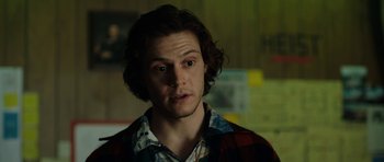 Movie still from “American Animals” (2018), directed by Bart Layton – A person wearing a plaid shirt; Close Up shot, Over the shoulder angle