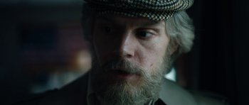 Movie still from “American Animals” (2018), directed by Bart Layton – A person wearing a hat; Close Up shot, Over the shoulder angle