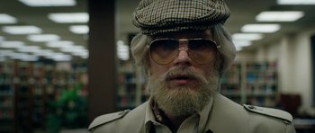 Movie still from “American Animals” (2018), directed by Bart Layton – A person wearing sunglasses and a hat; Close Up shot, Low angle