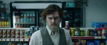 Movie still from “American Animals” (2018), directed by Bart Layton – A man with long hair and a long beard; Medium shot, Over the shoulder angle