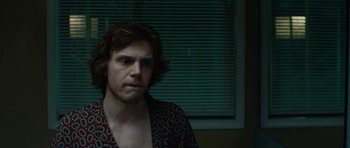 Movie still from “American Animals” (2018), directed by Bart Layton – A man with a beard is staring at the camera; Close Up shot, Over the shoulder angle