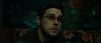 Movie still from “American Animals” (2018), directed by Bart Layton – A person wearing glasses; Close Up shot, Low angle