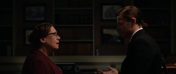 Movie still from “American Animals” (2018), directed by Bart Layton – A man and a woman are talking in a room; Medium shot, Over the shoulder angle