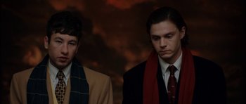 Movie still from “American Animals” (2018), directed by Bart Layton – Two young men in suits and scarfs standing next to each other; Close Up shot, Low angle