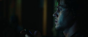 Movie still from “American Animals” (2018), directed by Bart Layton – A person using a cell phone; Close Up shot, Low angle