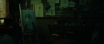Movie still from “American Animals” (2018), directed by Bart Layton – An empty room with a lot of pictures on the wall; Extreme Close Up shot, High angle