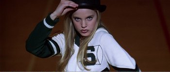 Movie still from “American Beauty” (1999), directed by Sam Mendes – A beautiful young lady wearing a black hat; Close Up shot, High angle