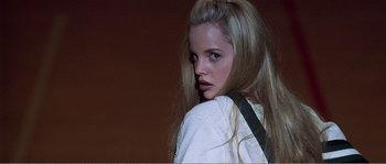 Movie still from “American Beauty” (1999), directed by Sam Mendes – A beautiful young woman with long blonde hair and blue eyes; Close Up shot, Low angle