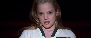 Movie still from “American Beauty” (1999), directed by Sam Mendes – A person with long blonde hair; Close Up shot, Low angle