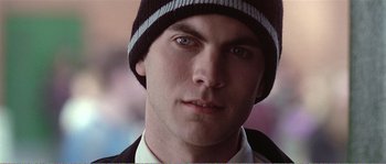 Movie still from “American Beauty” (1999), directed by Sam Mendes – A person wearing a hat; Close Up shot, Low angle