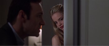 Movie still from “American Beauty” (1999), directed by Sam Mendes – A man and a woman looking at each other; Close Up shot, Low angle