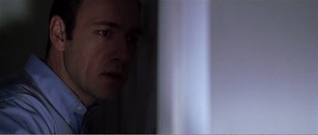 Movie still from “American Beauty” (1999), directed by Sam Mendes – A person looking at the camera; Close Up shot, Over the shoulder angle