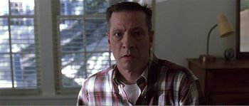 Movie still from “American Beauty” (1999), directed by Sam Mendes – A person wearing a plaid shirt; Close Up shot, Low angle
