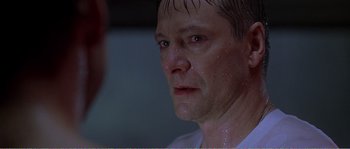 Movie still from “American Beauty” (1999), directed by Sam Mendes – A person wearing a white shirt; Close Up shot, Over the shoulder angle