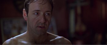 Movie still from “American Beauty” (1999), directed by Sam Mendes – A person looking at the camera; Close Up shot, Over the shoulder angle