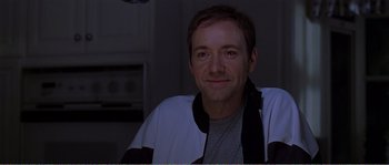 Movie still from “American Beauty” (1999), directed by Sam Mendes – A person wearing a jacket; Close Up shot, Over the shoulder angle