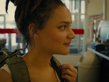 Movie still from “American Honey” (2016), directed by Andrea Arnold – A woman holding onto a piece of cloth; Close Up shot, Over the shoulder angle